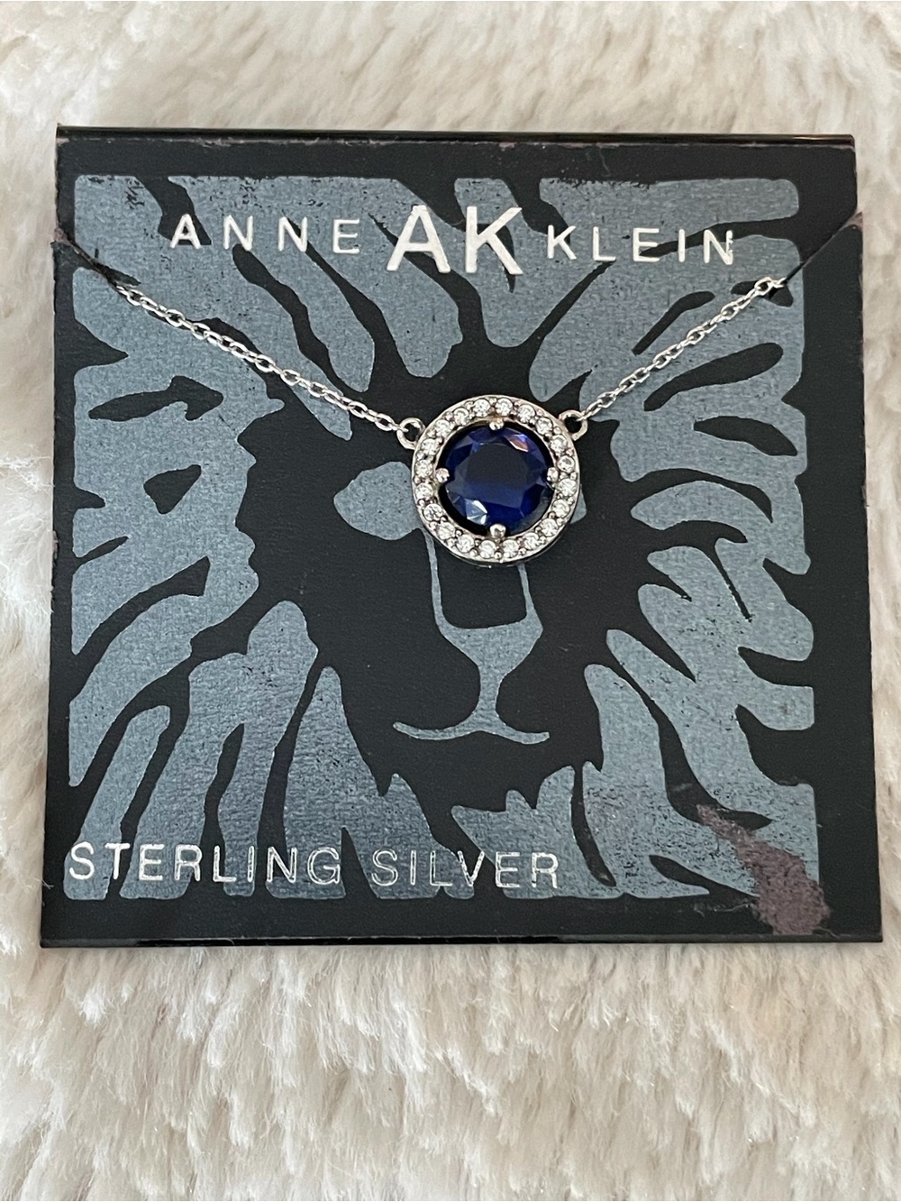 Anne Klein Silver Necklace with Deep Blue Crystal Halo